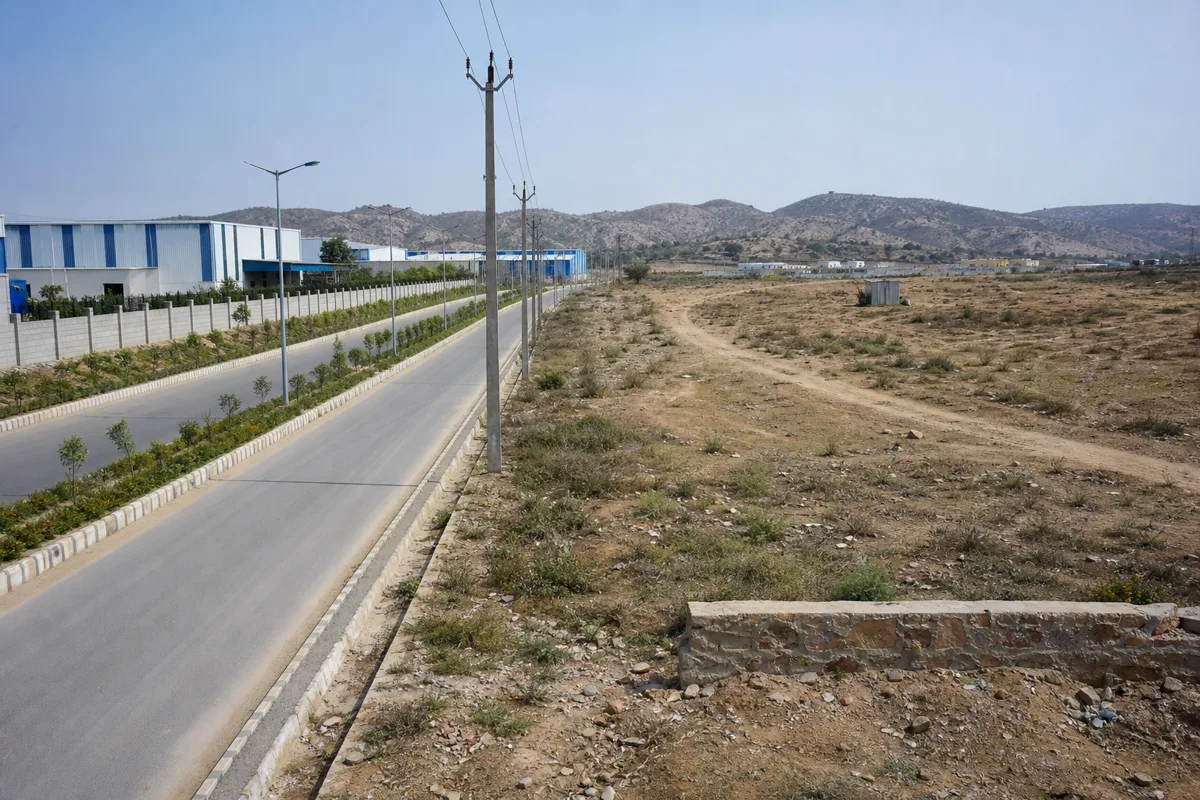 A serviced RIICO-style industrial plot compared with private industrial land near Bhiwadi