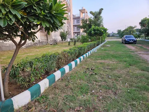Park and built houses inside Dwarkadhis City, with resident parking