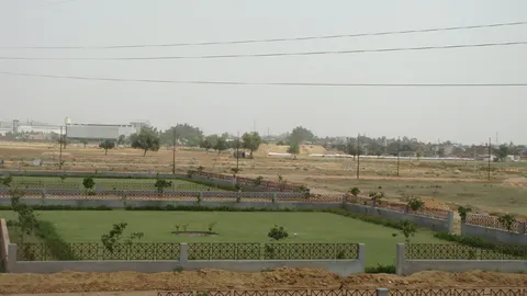 Landscaped plots and green belt inside Dwarkadhis City, Sector 23, Dharuhera