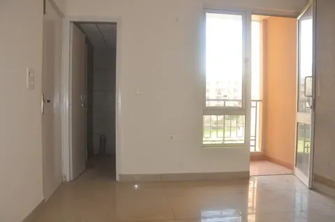 Room with balcony access, this 2 BHK flat at Essentia, Bhiwadi