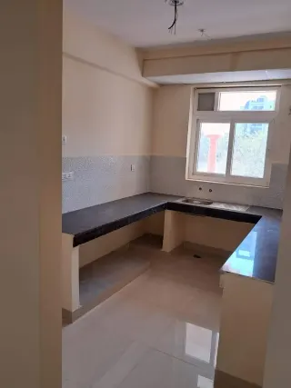 Kitchen with granite counter, this 3 BHK flat at HFL Presidency Estate, Bhiwadi