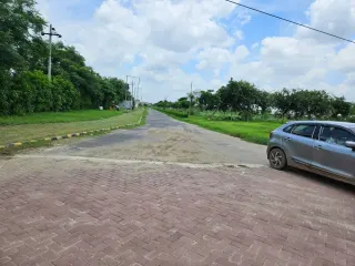 Internal road junction with a paved apron in Krish Season township, Bhiwadi