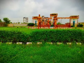 Family sculpture on the lawn in front of the Lifestyle City entrance gate, Alwar Bypass Road, Bhiwadi