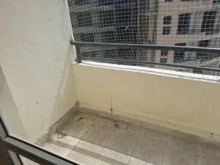 Balcony with safety netting, this 3 BHK flat at MVL Coral, Bhiwadi