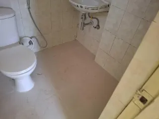 Third bathroom with beige wall tiles, this flat at MVL Coral, Bhiwadi