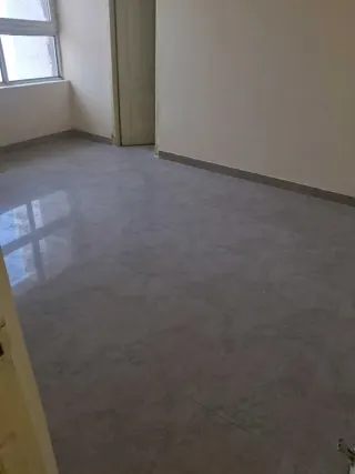 Bedroom with a corner window, this 3 BHK flat at MVL Coral, Bhiwadi