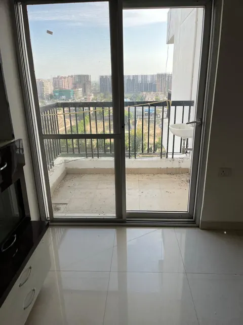 Room with balcony access, this 2 BHK flat at Essentia, Bhiwadi