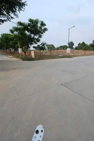 Road frontage along the unbuilt plot rows in Terra City, Bhiwadi