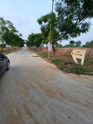 Internal road and plot number signage in the Terra City plotted sector, Bhiwadi