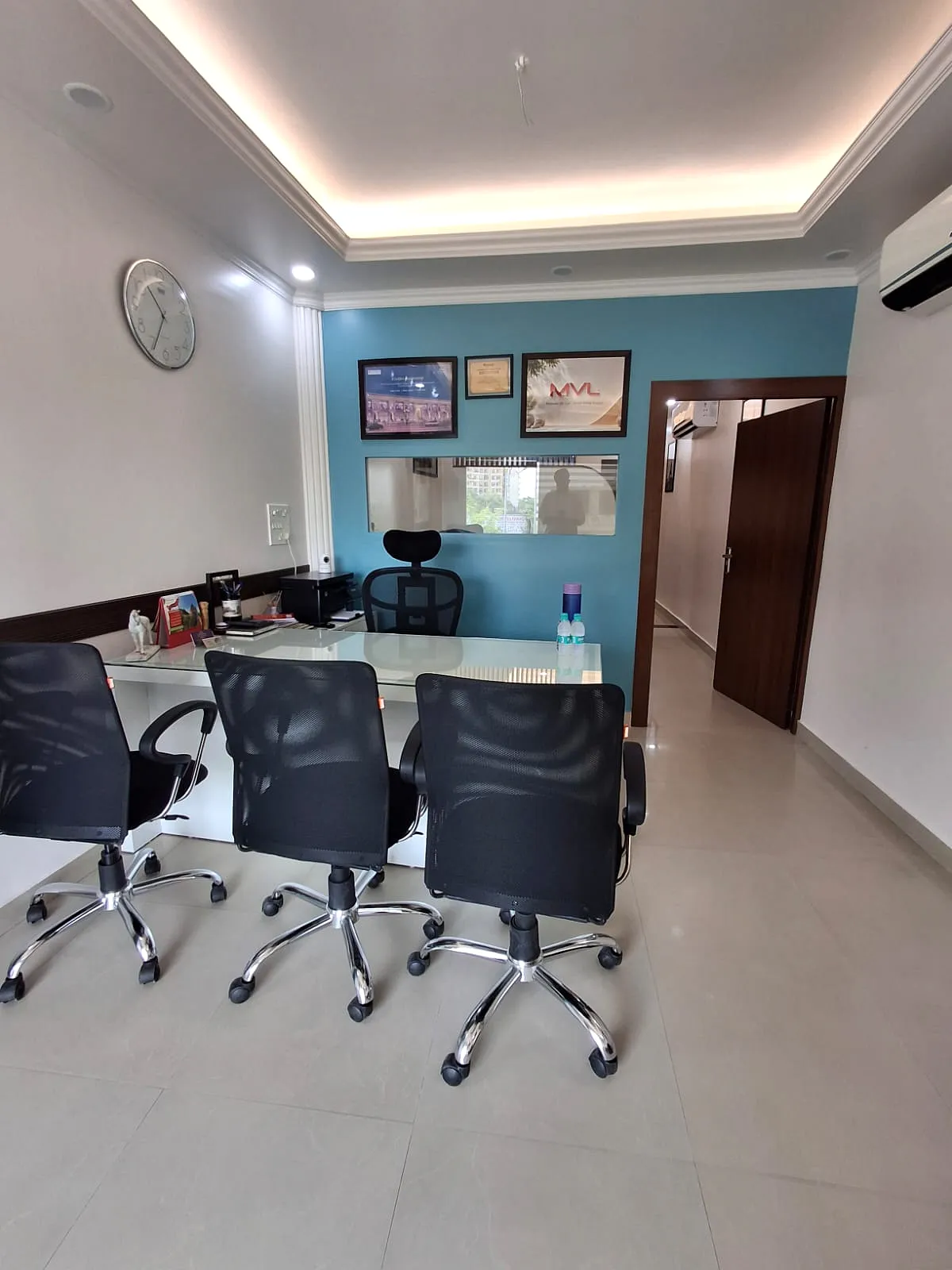 Inside the Shivam Properties office in Bhiwadi, meeting desk and client seating