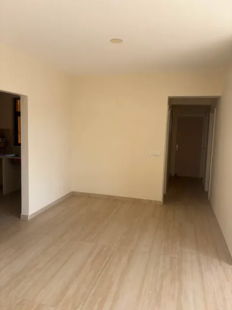 Entrance hall of an Ashiana Tarang flat opening to the kitchen and a corridor to the bedrooms, Bhiwadi